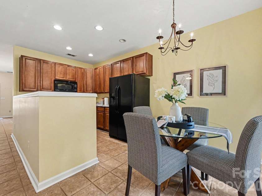 1005 Silver Spring Road, Fort Mill, SC 29715.  MLS# CAR4386266, YatesRealty ID 31947. Eating area open to living room