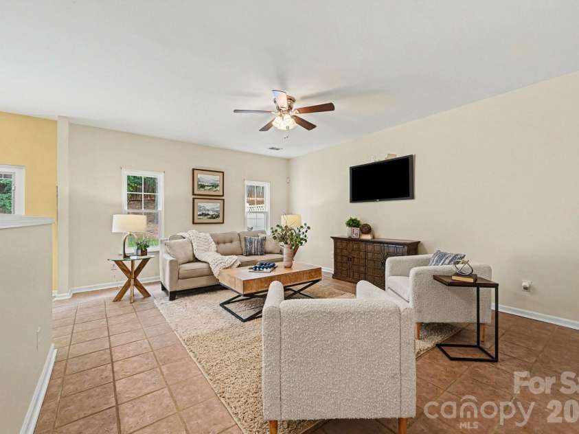 1005 Silver Spring Road, Fort Mill, SC 29715.  MLS# CAR4386266, YatesRealty ID 31947. Living room open to kitchen area