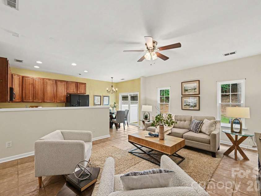 1005 Silver Spring Road, Fort Mill, SC 29715.  MLS# CAR4386266, YatesRealty ID 31947. View into kitchen from living area