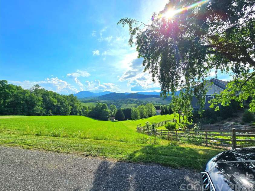 37 Justice Drive, Leicester, NC 28748.  MLS# CAR4393415, YatesRealty ID 31957. Across the st