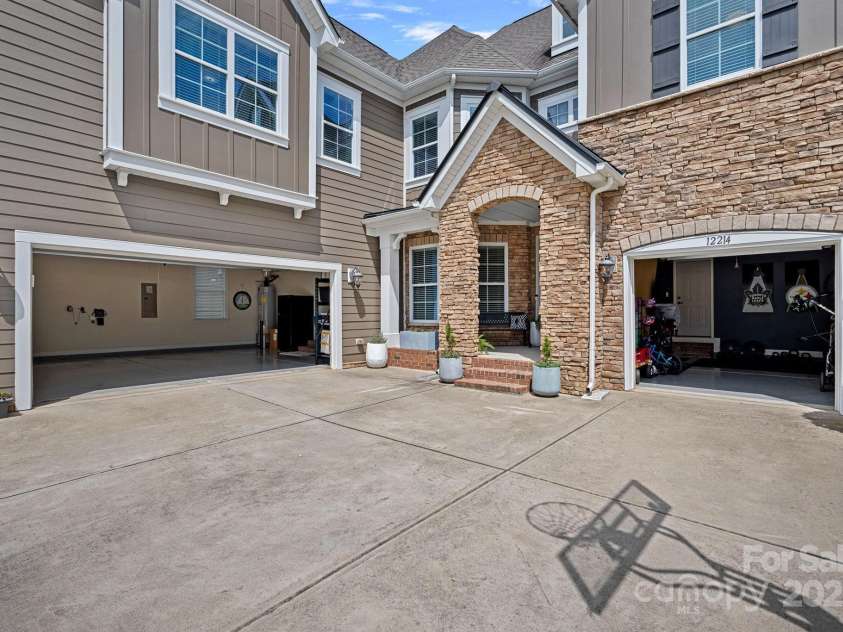 12214 Bonny Oaks Drive, Cornelius, NC 28031.  MLS# CAR4264474, YatesRealty ID 31958. 3 car garage is rare in this community!!