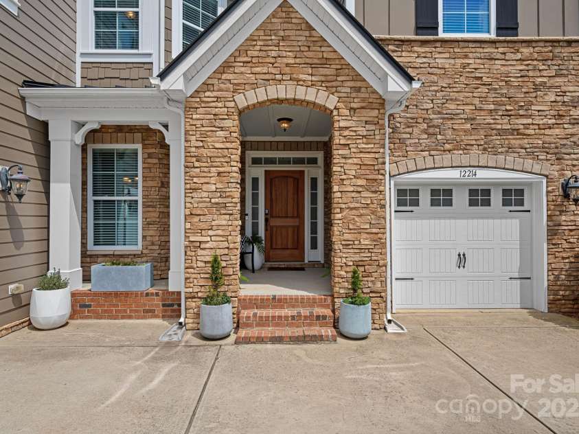 12214 Bonny Oaks Drive, Cornelius, NC 28031.  MLS# CAR4264474, YatesRealty ID 31958. Adorable covered front porch