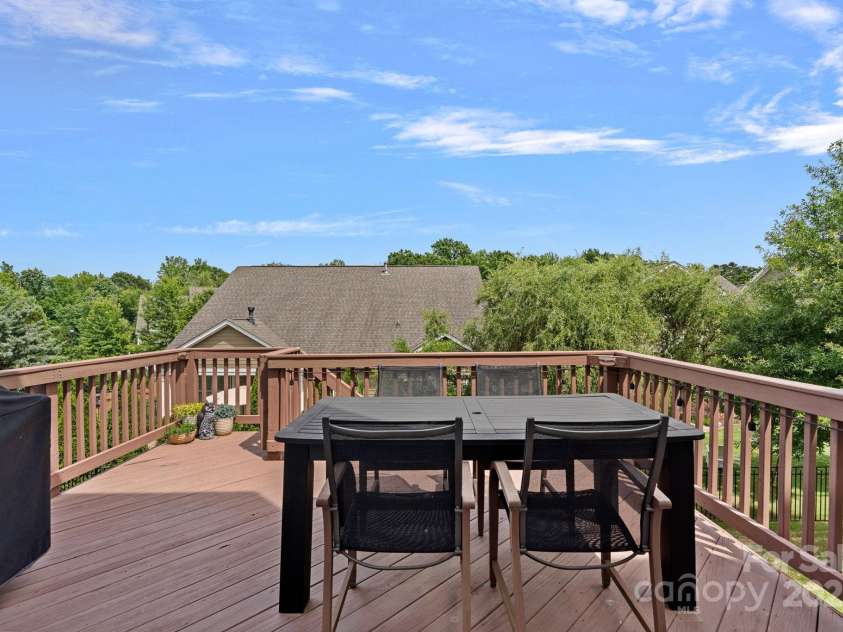 12214 Bonny Oaks Drive, Cornelius, NC 28031.  MLS# CAR4264474, YatesRealty ID 31958. Deck off of kitchen. Gas line is connected up on deck- no need for a propane tank!!