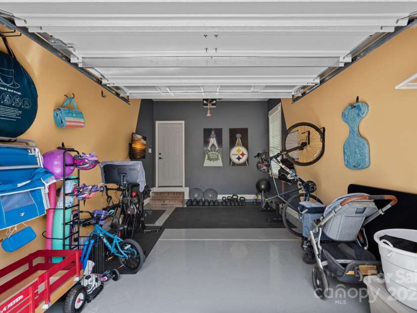12214 Bonny Oaks Drive, Cornelius, NC 28031.  MLS# CAR4264474, YatesRealty ID 31958. Epoxy Flooring and immaculate. The single bay currently used as a home gym and toy storage!