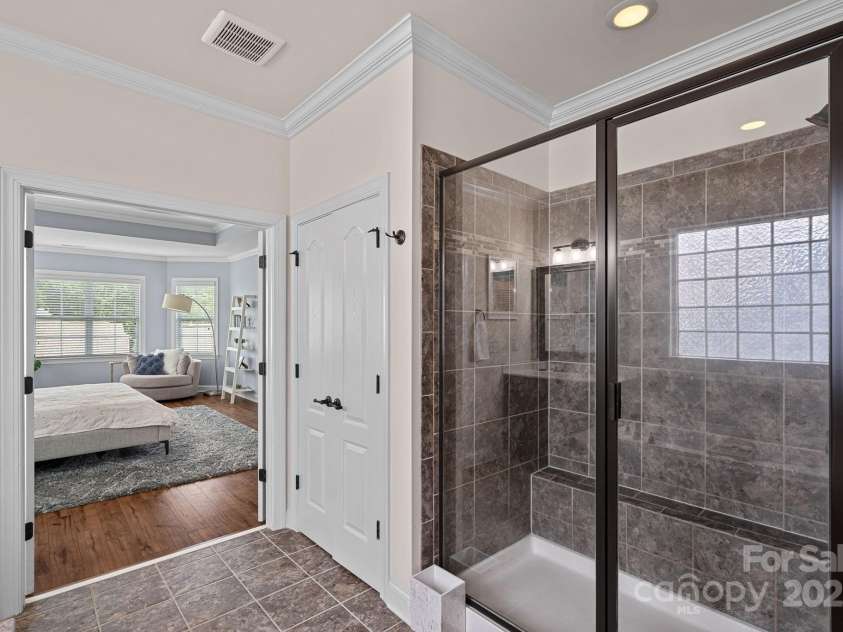12214 Bonny Oaks Drive, Cornelius, NC 28031.  MLS# CAR4264474, YatesRealty ID 31958. Large shower in Primary bathroom