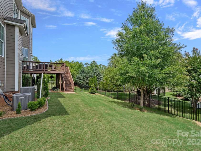 12214 Bonny Oaks Drive, Cornelius, NC 28031.  MLS# CAR4264474, YatesRealty ID 31958. Nice backyard with plenty of play space and FULLY fenced!