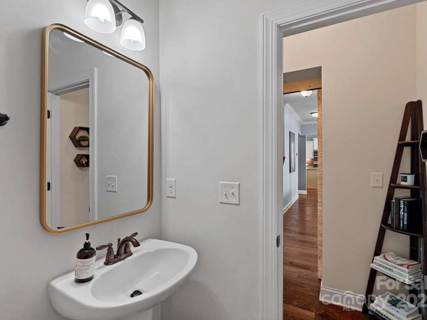 12214 Bonny Oaks Drive, Cornelius, NC 28031.  MLS# CAR4264474, YatesRealty ID 31958. Powder Room-Main level just inside single garage door near living room