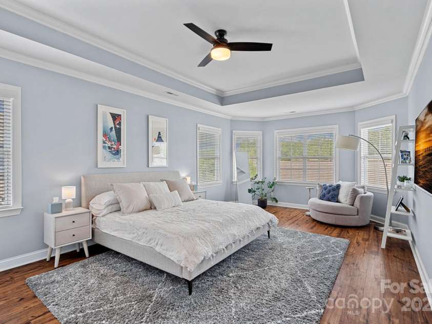 12214 Bonny Oaks Drive, Cornelius, NC 28031.  MLS# CAR4264474, YatesRealty ID 31958. Primary Bedroom. VERY spacious with tray ceiling  and wood floors