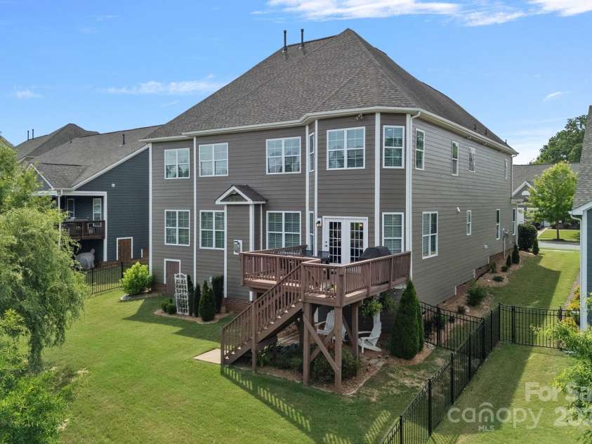 12214 Bonny Oaks Drive, Cornelius, NC 28031.  MLS# CAR4264474, YatesRealty ID 31958. Rear view of the home