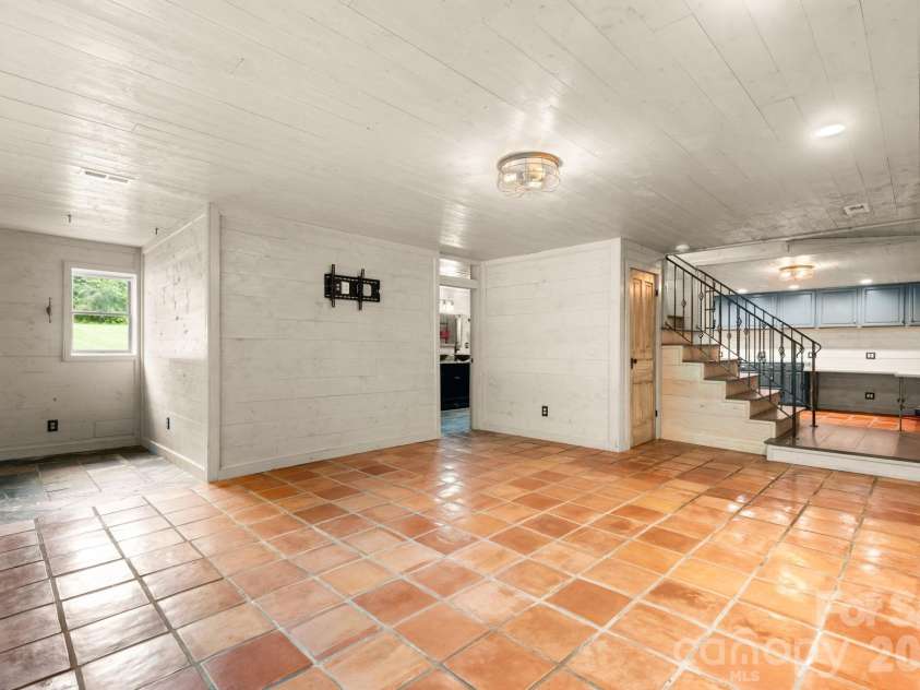 3110 Ninth Tee Drive, Newton, NC 28658.  MLS# CAR4427024, YatesRealty ID 31959. Basement area view toward stairs