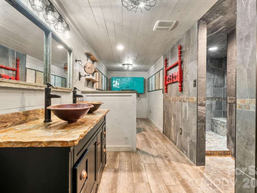 3110 Ninth Tee Drive, Newton, NC 28658.  MLS# CAR4427024, YatesRealty ID 31959. Basement primary suite bathroom