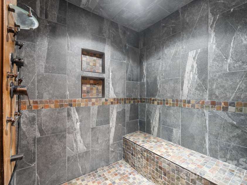 3110 Ninth Tee Drive, Newton, NC 28658.  MLS# CAR4427024, YatesRealty ID 31959. Basement primary suite walk in shower