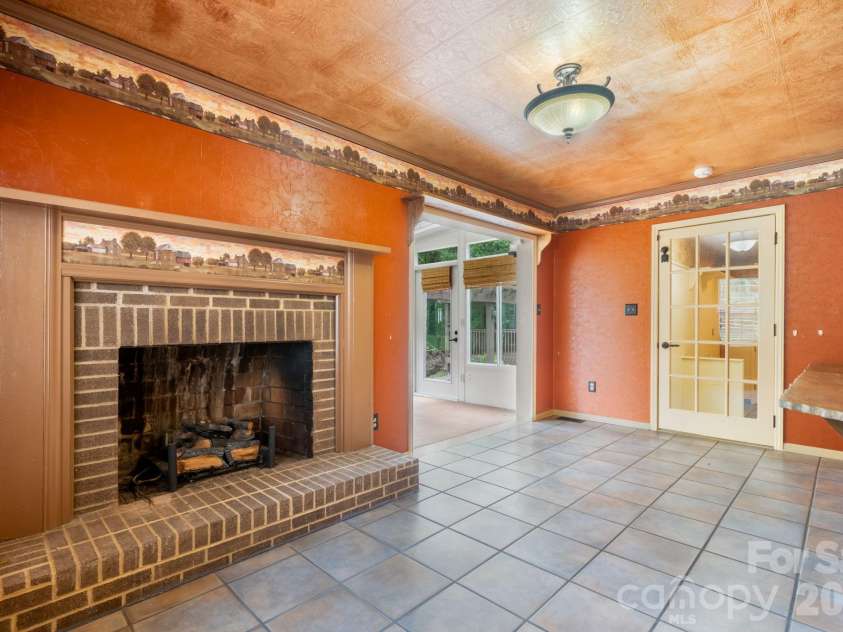 3110 Ninth Tee Drive, Newton, NC 28658.  MLS# CAR4427024, YatesRealty ID 31959. Den fireplace