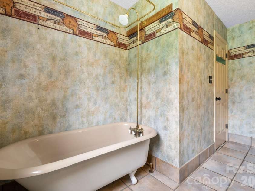 3110 Ninth Tee Drive, Newton, NC 28658.  MLS# CAR4427024, YatesRealty ID 31959. Main level full bath 1 clawfoot tub and shower
