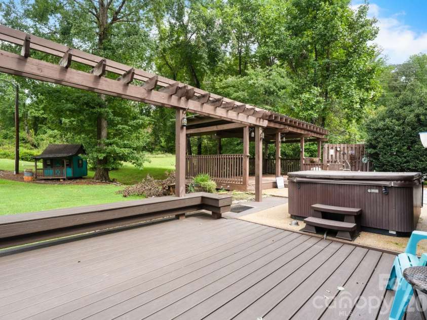 3110 Ninth Tee Drive, Newton, NC 28658.  MLS# CAR4427024, YatesRealty ID 31959. Outdoor deck with hot tub
