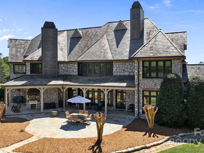 525 Lake Lynn Road, Concord, NC 28025.  MLS# CAR4239397, YatesRealty ID 3196. Back of home showing covered porches and grilling station