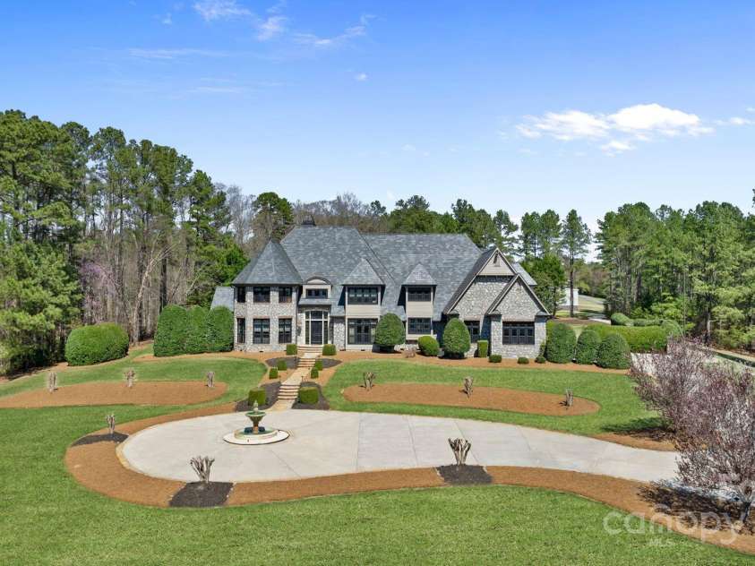 525 Lake Lynn Road, Concord, NC 28025.  MLS# CAR4239397, YatesRealty ID 3196. Curb appeal from every angle with circular driveway and fountain