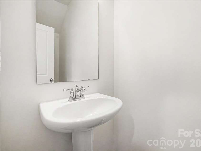 5222 Maynard Hill Drive, Monroe, NC 28110.  MLS# CAR4386034, YatesRealty ID 31971. Downstair half bath