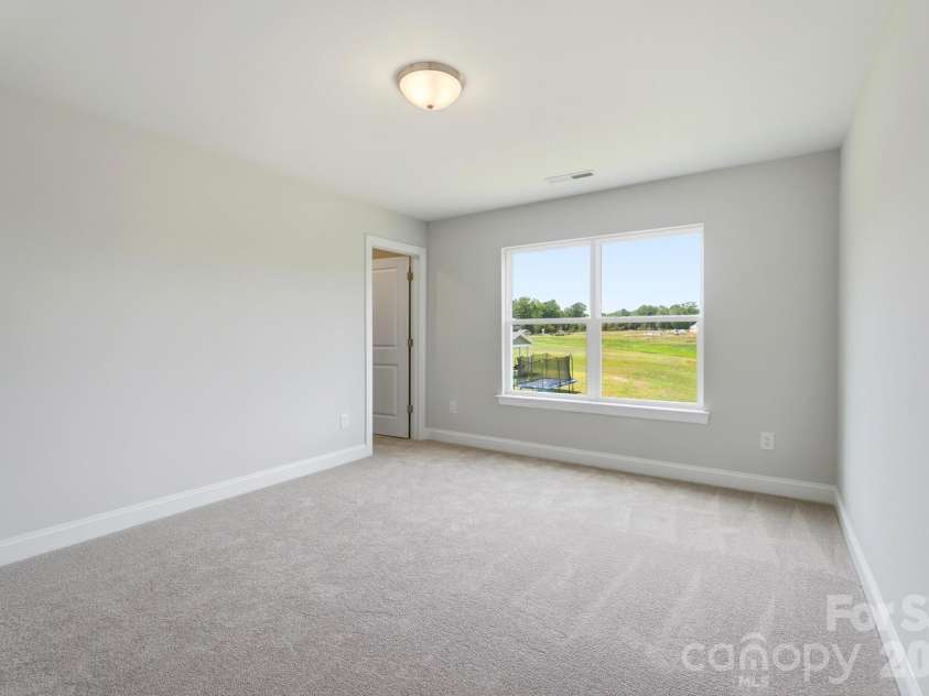 10806 Coble Road, Charlotte, NC 28227.  MLS# CAR4359421, YatesRealty ID 31977. Upper level bedroom