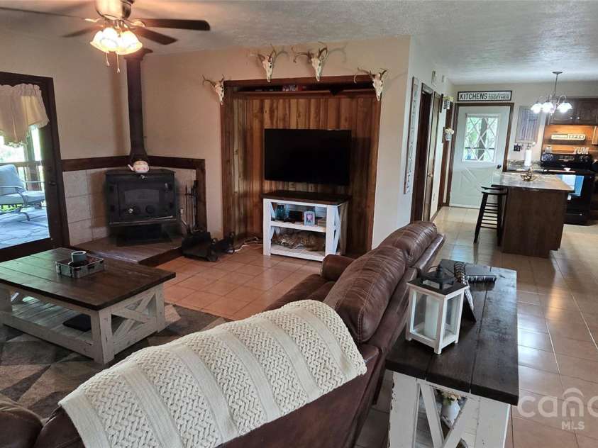 414 Pine Cove Road, Old Fort, NC 28762.  MLS# CAR4276158, YatesRealty ID 31977. Hall to side porch door