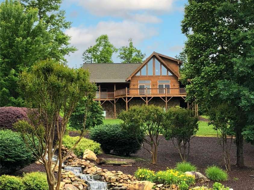 16 Saratoga Drive, Nebo, NC 28761.  MLS# CAR4338569, YatesRealty ID 3198. View of Home from Community Waterfall Below