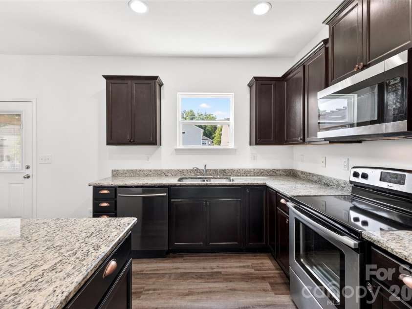 9013 Magnolia Lily Avenue, Charlotte, NC 28227.  MLS# CAR4392385, YatesRealty ID 31988. Open concept kitchen and living space