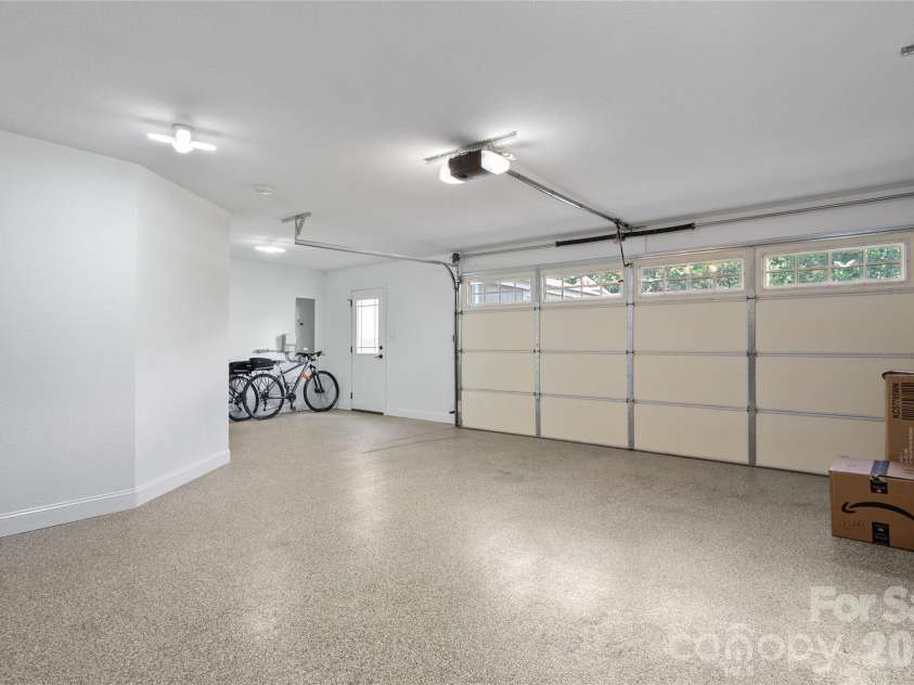 34 Justice Drive, Leicester, NC 28748.  MLS# CAR4394117, YatesRealty ID 31989. Epoxy coated floors with extra room for storage