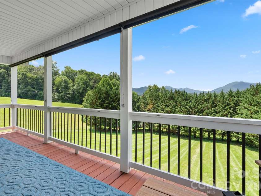 34 Justice Drive, Leicester, NC 28748.  MLS# CAR4394117, YatesRealty ID 31989. Mature hedging for privacy