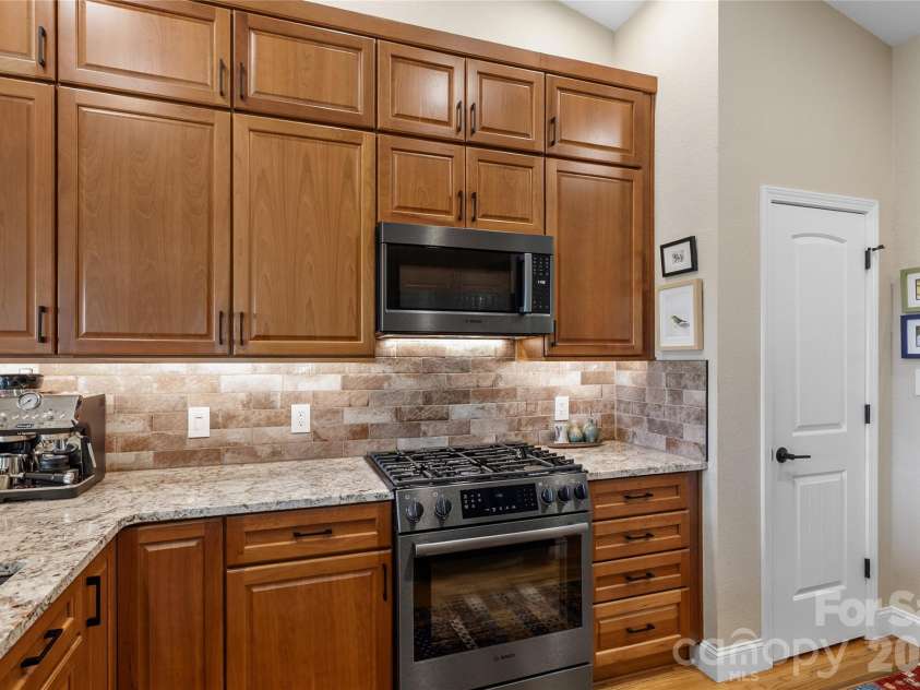 34 Justice Drive, Leicester, NC 28748.  MLS# CAR4394117, YatesRealty ID 31989. Solid cherry cabinets with LED dimmable undercabinet lighting.