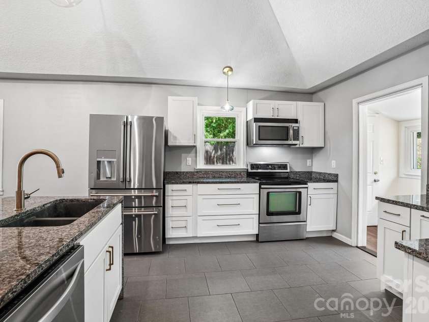 3 View Street, Asheville, NC 28803.  MLS# CAR4383178, YatesRealty ID 31991. Kitchen from hallway
