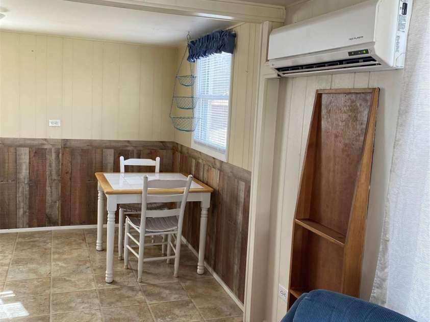 565 Neely Road, Brevard, NC 28712.  MLS# CAR3937381, YatesRealty ID 32. Apartment #1 Mini Split in LR and Dining Area off Kitchen