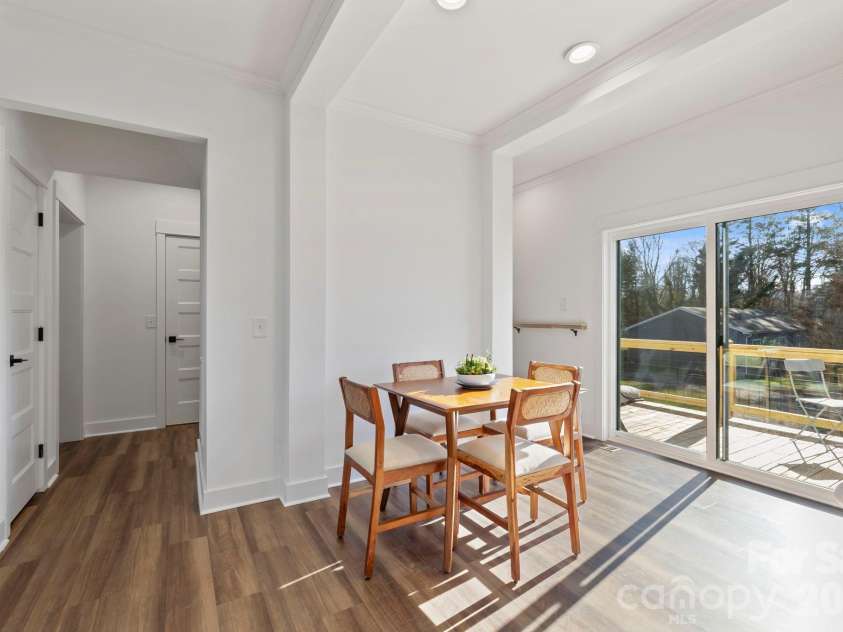 205 Southern Charm Road, Arden, NC 28704.  MLS# CAR4327536, YatesRealty ID 3200. Dining Area w/ sliding doors to rear deck