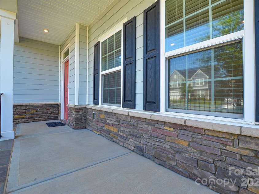 128 Tetcott Street, Mooresville, NC 28115.  MLS# CAR4283720, YatesRealty ID 32002. Southern-Style Front Porch