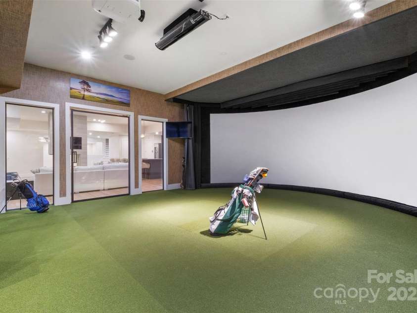 17235 Connor Quay Court, Cornelius, NC 28031.  MLS# CAR4291323, YatesRealty ID 32005. Golf Simulator Room