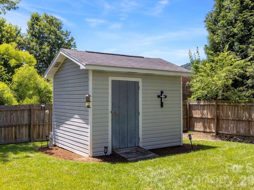 266 Wildbriar Road, Fletcher, NC 28732.  MLS# CAR4394463, YatesRealty ID 32005. Detached storage building provides additional space for tools, equipment, or seasonal storage needs.