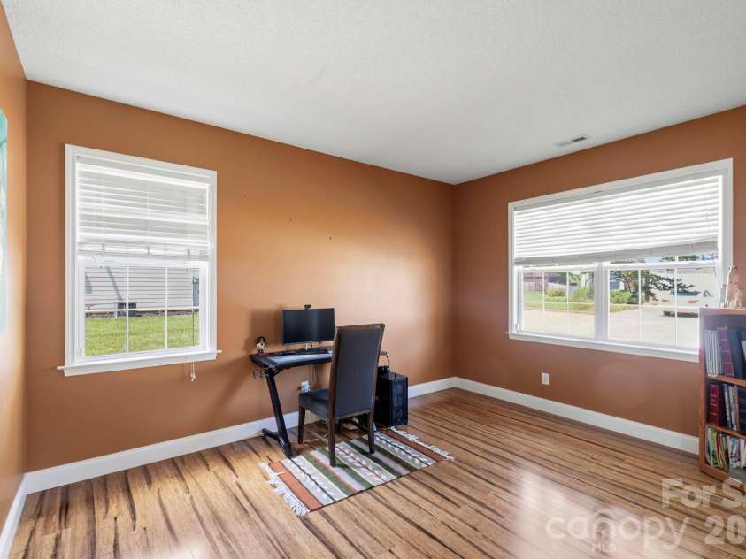 266 Wildbriar Road, Fletcher, NC 28732.  MLS# CAR4394463, YatesRealty ID 32005. Spacious home office with large windows, natural light, and flexible space for remote work, study, or hobbies.
