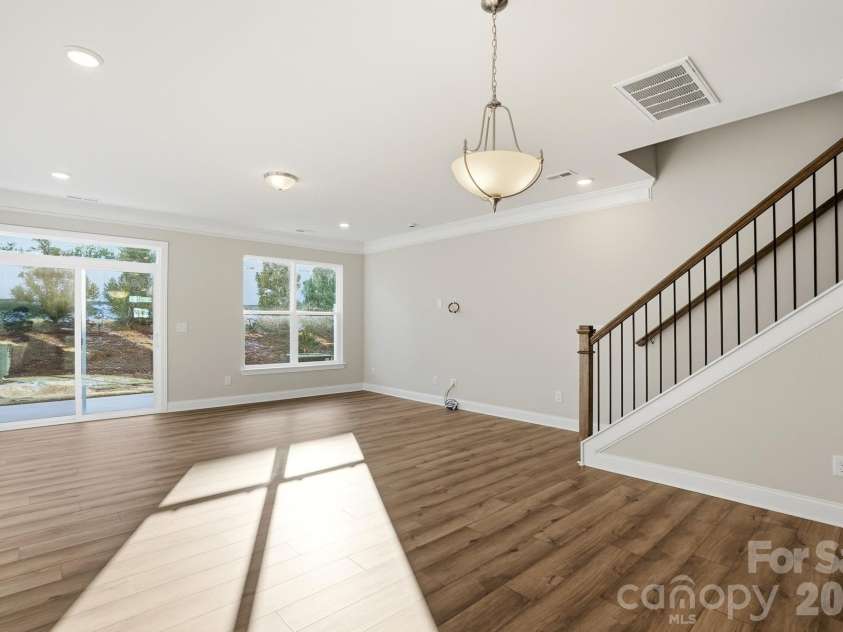 4211 Black Court, Harrisburg, NC 28075.  MLS# CAR4237204, YatesRealty ID 32013. Dining area and family room