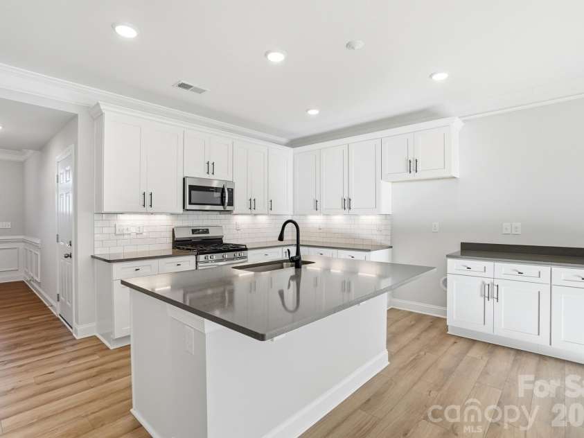 4211 Black Court, Harrisburg, NC 28075.  MLS# CAR4237204, YatesRealty ID 32013. Kitchen and dining area