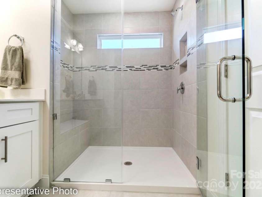 4211 Black Court, Harrisburg, NC 28075.  MLS# CAR4237204, YatesRealty ID 32013. Primary bath features framed shower door ilo frameless