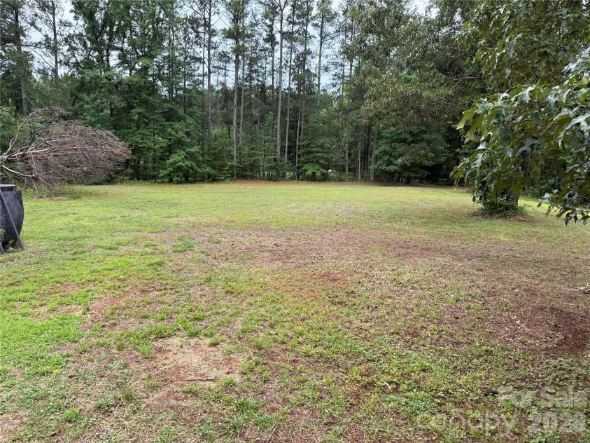 211 Corry Lane, Bostic, NC 28018.  MLS# CAR4392123, YatesRealty ID 32023. Flat side yard