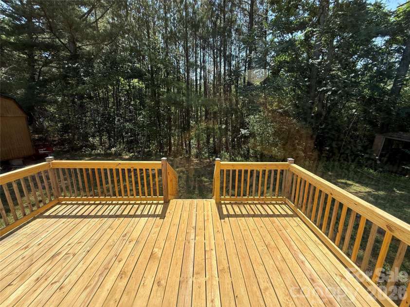 211 Corry Lane, Bostic, NC 28018.  MLS# CAR4392123, YatesRealty ID 32023. Large Back Deck