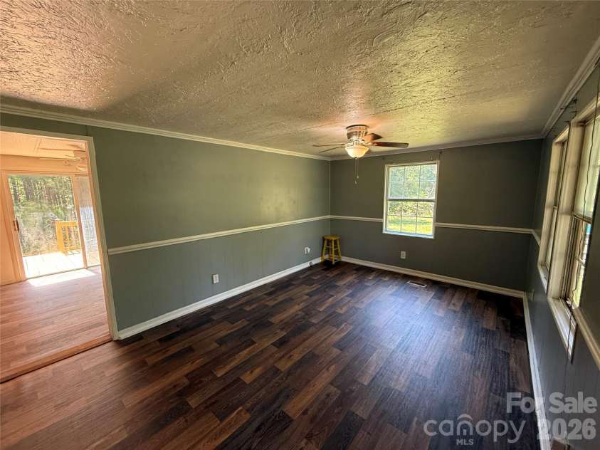 211 Corry Lane, Bostic, NC 28018.  MLS# CAR4392123, YatesRealty ID 32023. Living Room looking into kitchen