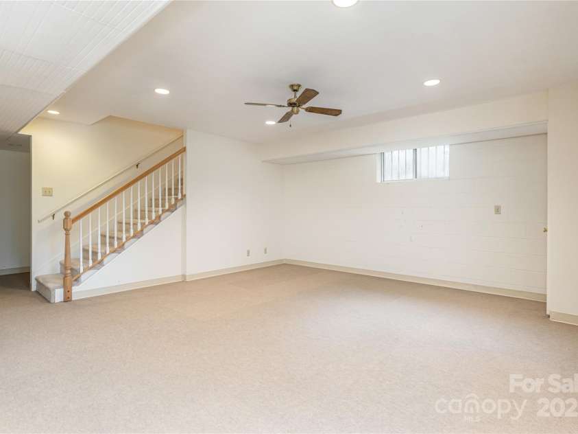27 Country Road, Hendersonville, NC 28791.  MLS# CAR4290283, YatesRealty ID 32028. Large finished area in basement