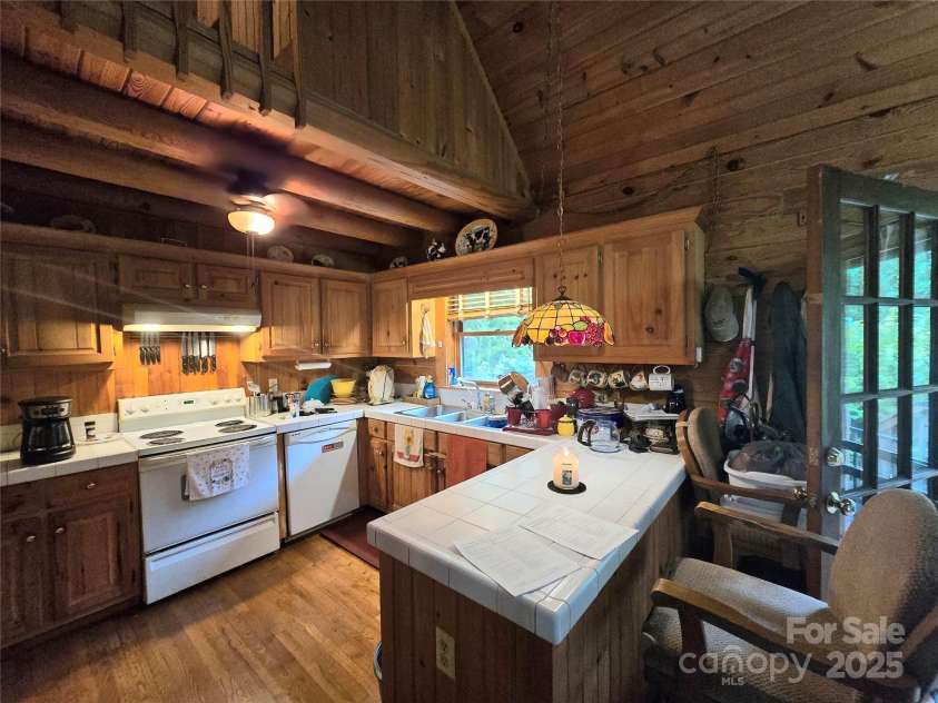 112 Ashe Bridge Road, Marion, NC 28752.  MLS# CAR4288722, YatesRealty ID 32033. Kitchen open to great room