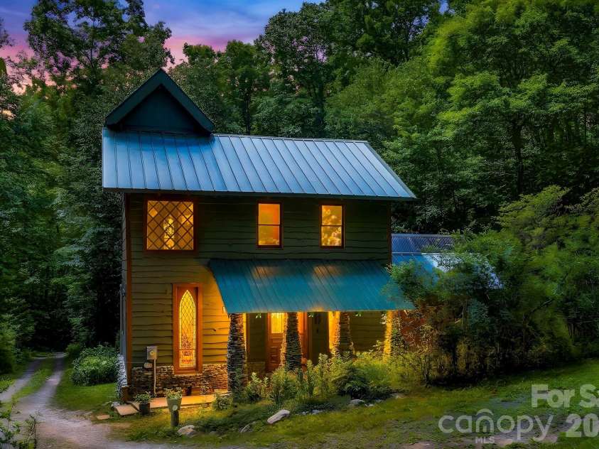 173 Camp Elliott Road, Black Mountain, NC 28711.  MLS# CAR4394206, YatesRealty ID 32036. Magic abounds with theglowing windows