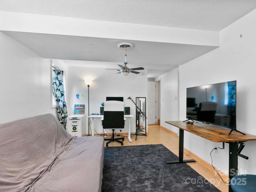 115 Chapman Drive, Asheville, NC 28805.  MLS# CAR4217914, YatesRealty ID 32039. Lower level finished room