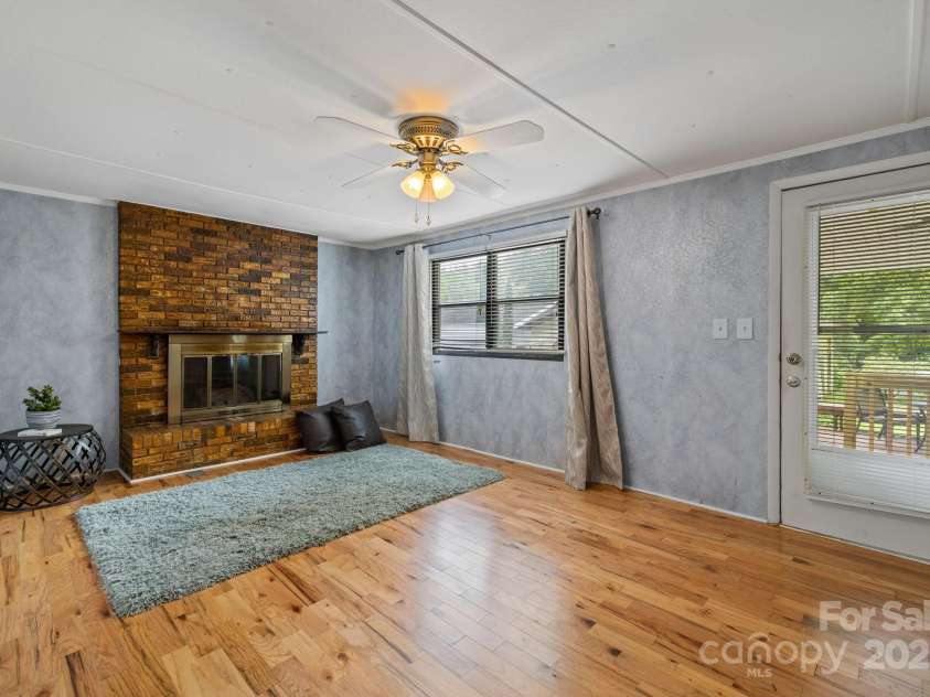 105 Corn Drive, Cedar Mountain, NC 28718.  MLS# CAR4289509, YatesRealty ID 32046. Living/family room