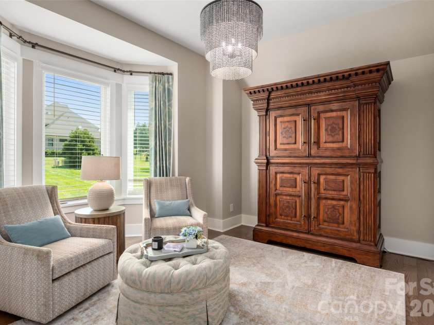 10035 Whispering Falls Avenue, Charlotte, NC 28227.  MLS# CAR4393646, YatesRealty ID 32047. A private office with oversized windows offers abundant natural light and a bright, inviting workspace.
