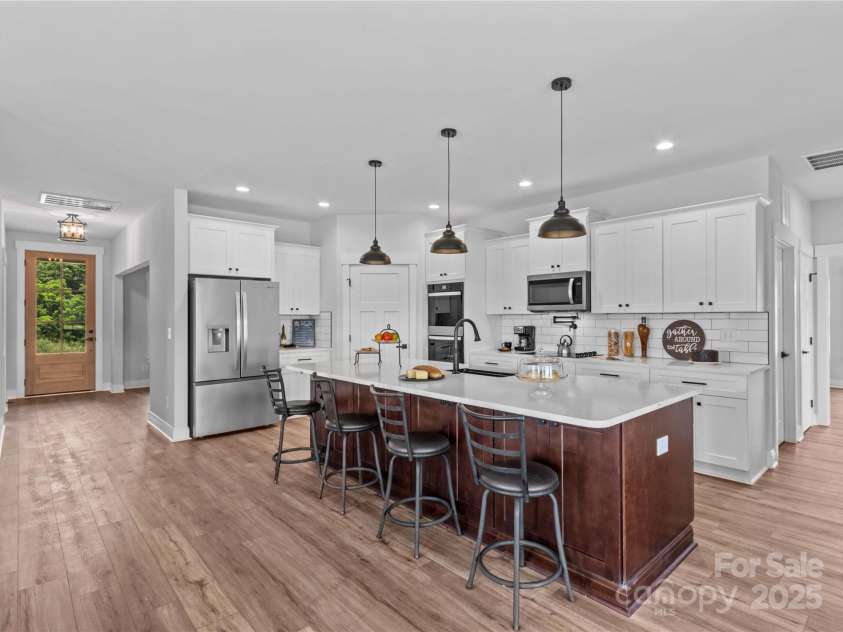 1260 Coppergate Drive, Salisbury, NC 28147.  MLS# CAR4273258, YatesRealty ID 32053. Dream kitchen with 10 ft quartz island, stainless appliances, Pot filler, walk in Pantry.
