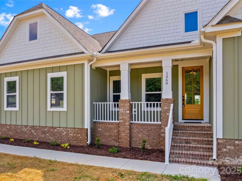 1260 Coppergate Drive, Salisbury, NC 28147.  MLS# CAR4273258, YatesRealty ID 32053. Rocking chair front porch.